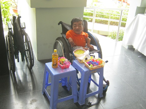 Saigon War Museum
2013: Agent Orange victim in a wheelchair
selling products 01 Saigon War Museum 2013: Agent
Orange victim in a wheelchair selling
products 01