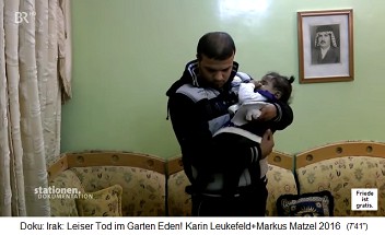 a father in Iraq presents a
child to Dr. Jabbar Said Falyh a
father in Iraq presents a child to Dr.
Jabbar Said Falyh