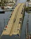 New Orleans: A canal bridge of a
                            freeway sticking out from the water after
                            hurricane Katrina.