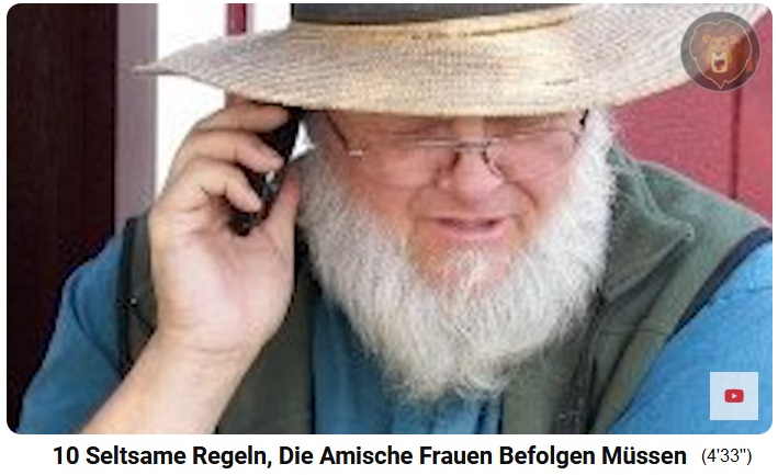 Amish-Mann mit Strohhut am Handy Amish-Mann mit Strohhut am Handy