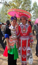 Laos, two Meo
(Hmong) women in traditional clothes at new
years celebration in Nasala Laos, two Meo (Hmong)
women in traditional clothes at new years
celebration in Nasala