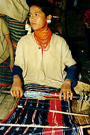 Thailand, Lawa girl weaving in
the region of Chian Mai Thailand, Lawa
girl weaving in the region of Chian Mai
