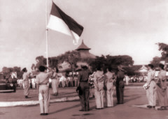 Raising the
                                Indonesian flag at Semarang, 1949.