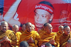 Demonstration of Buddha monks in orange
                        clothes in sinking Bangkok 2012 - it's up to
                        them to sink.