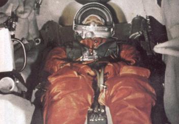 Yuri Gagarin's sitting test 3. The eyes are
                        focused on the camera and the hands are doing
                        nothing.