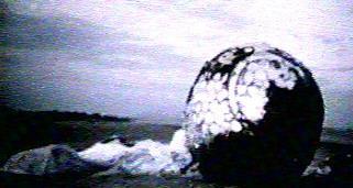 Gagarin's
                              alleged landing capsule on the meadow,
                              blurred foto from astronautix.com.