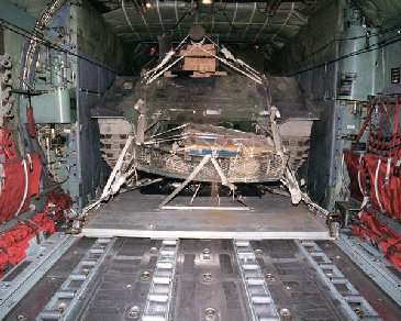 Airdrop of a
                        tank is prepared, the ramp is opened