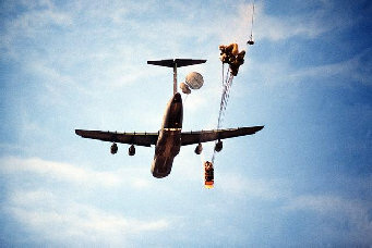 Airdrop of a tank
                        "Sheridan" from a Hercules C-5, the
                        parachutes are partly closed yet.