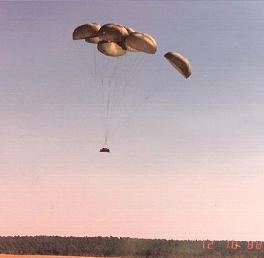 Airdrop of a tank "Sheridan",
                          the parachutes are open.
