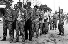Captured Cubans from
                              exile after the invasion at the Bay of
                              Pigs in 1961.