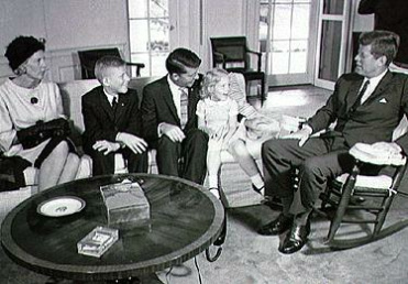 Schirra
                            family with President Kennedy.