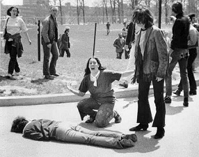 KentFour: Mary Ann Vecchio
                                  screaming with open arms beside the
                                  body of the student Jeffrey Miller who
                                  is lying on the campus of the State's
                                  University of Kent with the face
                                  downwards, 4 May 1970.