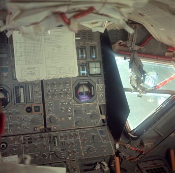 Apollo 11, photo no. AS11-36-5389: This
                        photo, taken during the initial LM inspection,
                        on the day before lunar orbit insertion, shows
                        the station of the lunar module, and a 16-mm
                        Data Acquisition Camera (DAC) mounted in the
                        LMP's window.