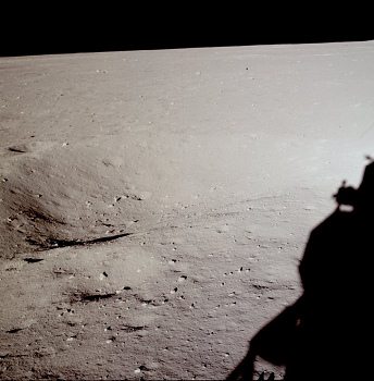 Apollo 11 photo no. AS11-37-5453: According
                        to NASA this is another photo of the "lunar
                        surface" directly under the window of
                        "astronaut" Neil Armstrong, now with
                        the Western part of the crater. The shadow of
                        the "lunar module" is the same as on
                        photo AS11-37-5451, and also the chaos of
                        shadows is the same.