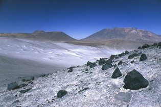 Atacama desert 16 near Salar de Aguas
                        Calientes: slopes with white salty layer, and
                        mountain ridge
