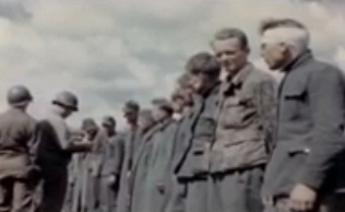 German prisoners of war in a queue
                              being searched by an "American"
                              soldier controlling documents (24min.
                              11sec.)