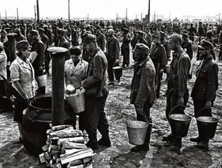 German prisoners of war getting soup in a
Russian prisoner of war camp after 1945 German prisoners of war getting soup in a
Russian prisoner of war camp after 1945