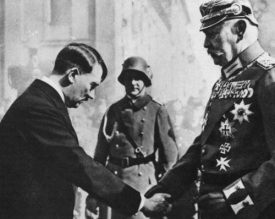 Hitler's bowing before Hindenburg,
                            January 1933
