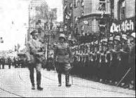 Remilitarization of Rhineland, Hitler
                            taking the salute of the guard of honor, 28
                            April 1936