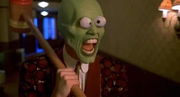 Photo text 1: MASK WITH MOUTH OPENING+NOSE OPENING:
Jim Carrey in "The Mask": The mask as a symbol
for the desire to be someone else. Photo text 1:
MASK WITH MOUTH OPENING+NOSE OPENING: Jim Carrey in
"The Mask": The mask as a symbol for the desire
to be someone else.