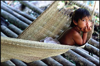 Native people in a
                        settlement in the Orinoco River delta