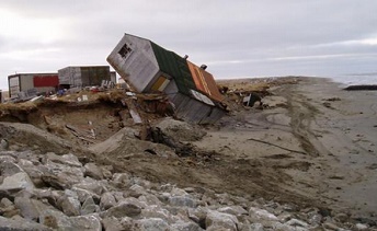 Defrozen permafrost ground:
overturned house by erosion on the river
side when the defrozen ground was eroded by
the river, Shishmaref, Alaska,
"U.S.A." Defrozen permafrost ground: overturned
house by erosion on the river side when the
defrozen ground was eroded by the river,
Shishmaref, Alaska, "U.S.A."